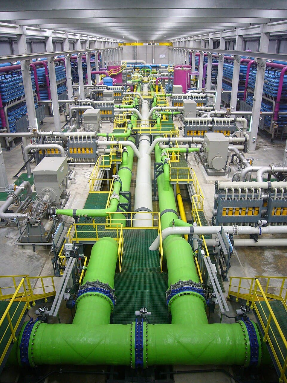Reverse osmosis desalination plant interior with membrane racks and piping